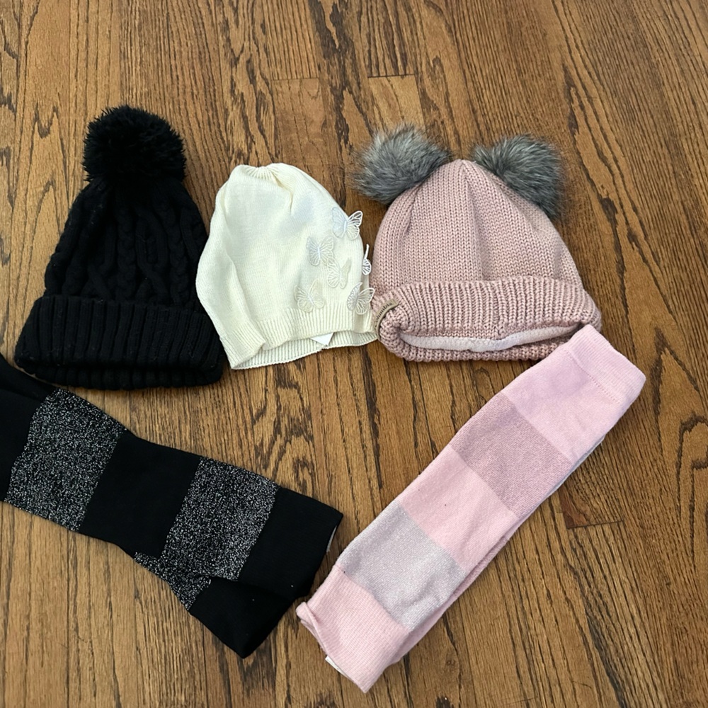 Three beanies and two leg warmers